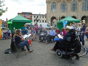 Singing for the brain session in the market place.