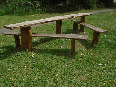Picnic benches and table set our in a triangular design