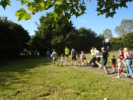 Scene of junior parkrun in progress.
